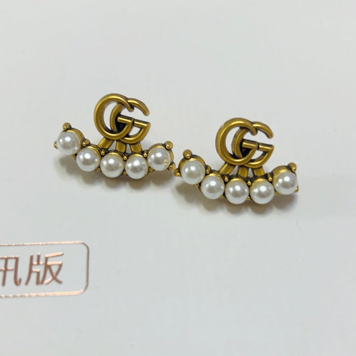 Pearl G earrings