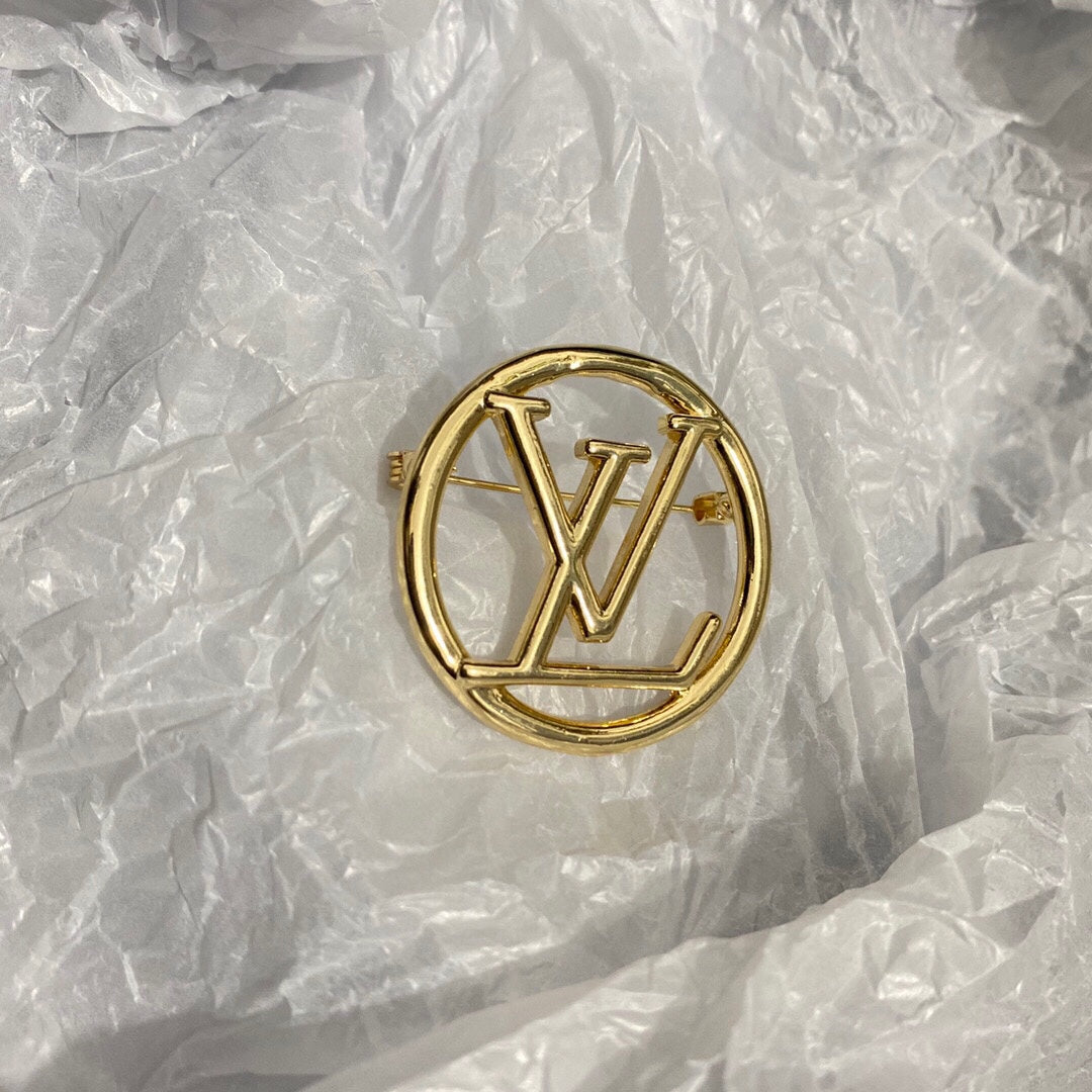 Gold letter brooch