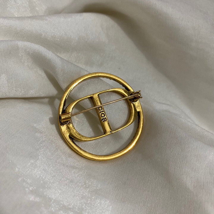 Gold CD letter brooch